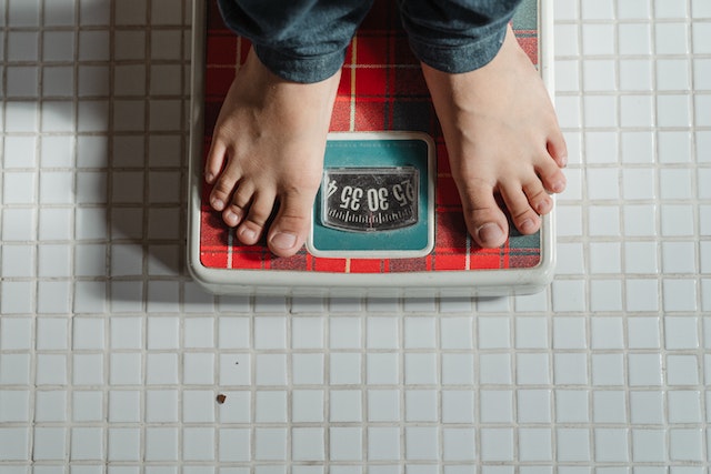 Man Showing Weight Loss